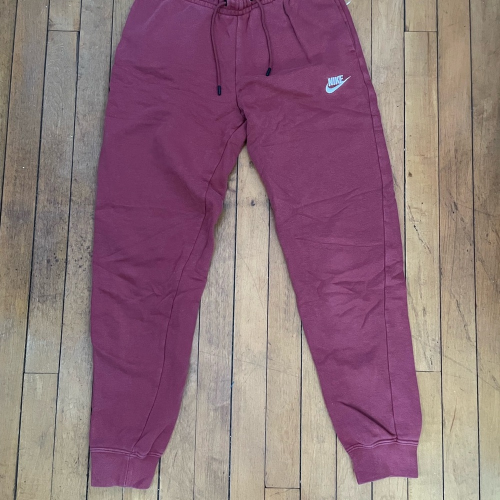 Nike Red Track Pants with Elastic Waistband and Cuffed Ankles